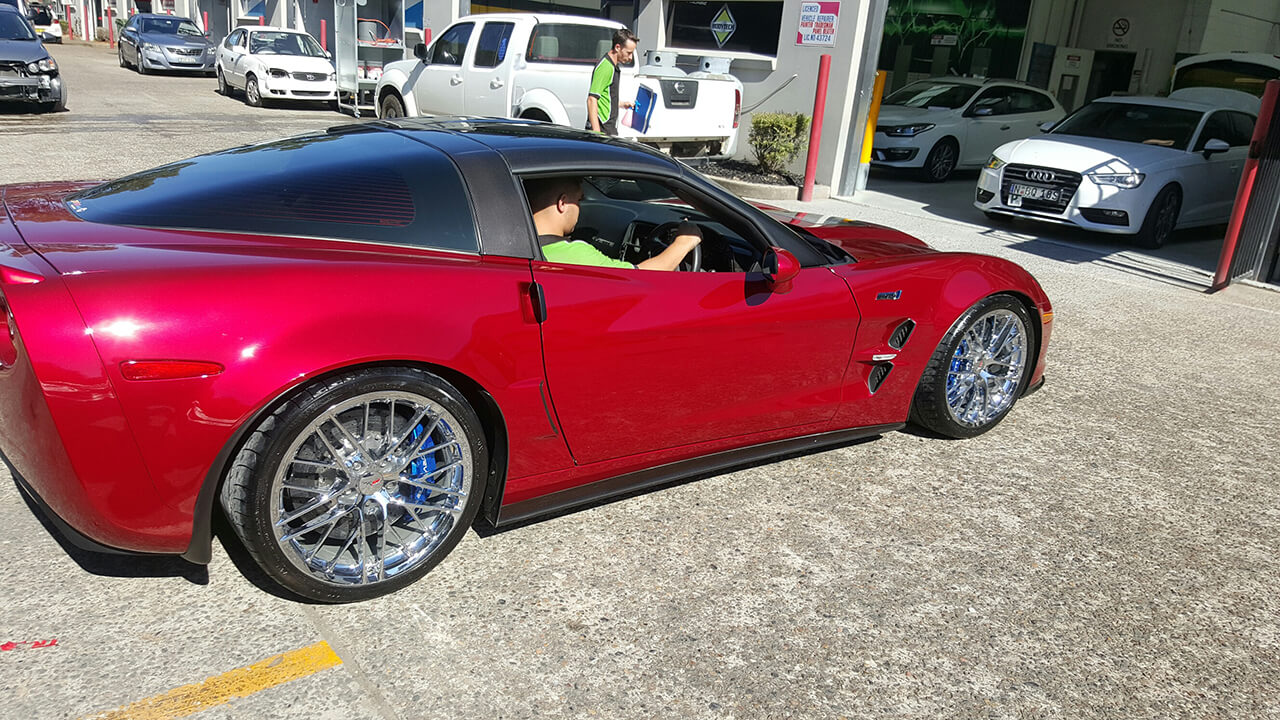 Red Corvette ZR3 with Bodytech member driving
