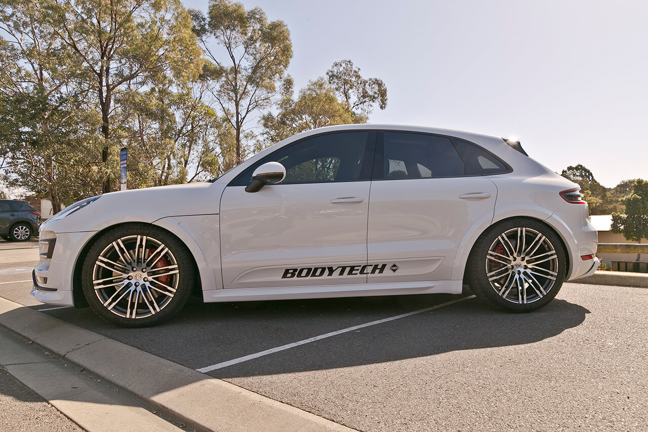 Side of customised Porsche in Sydney with Bodytech branding