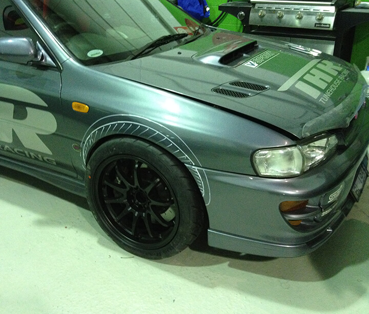 Side angle of Subaru WRX in for detailing