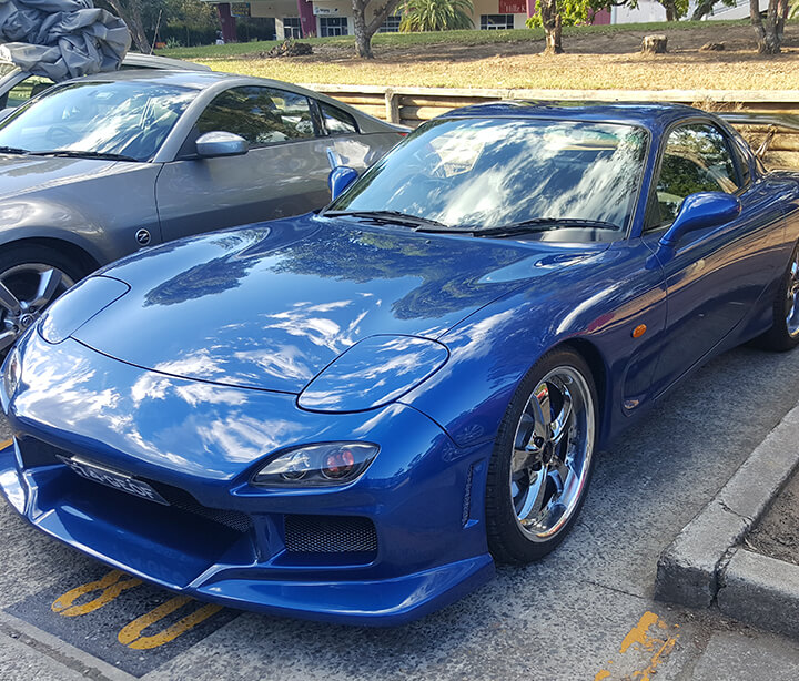 Side angle of blue RX7 detailed and resprayed