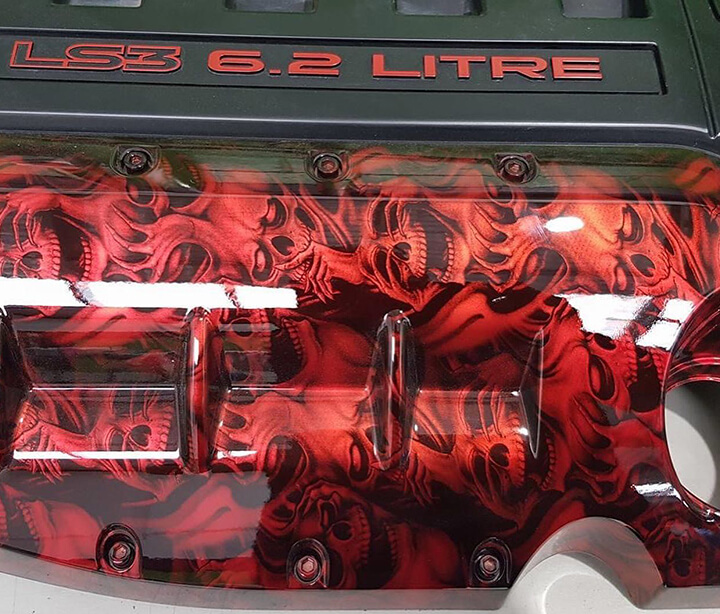 Red hydrographics on engine cover