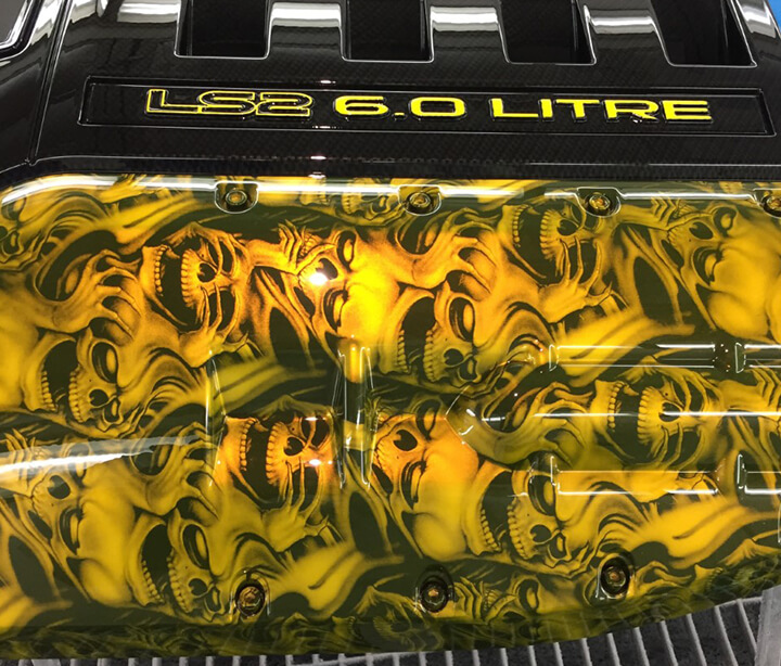 Yellow hydro graphics on engine cover