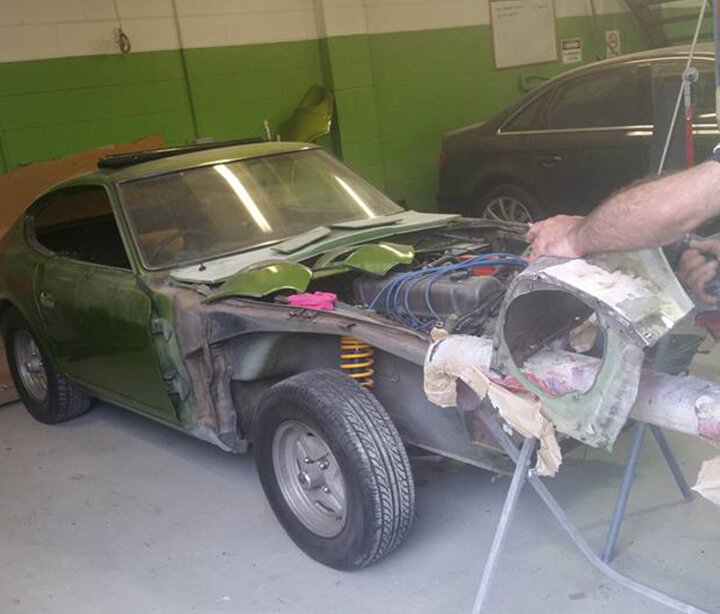 Car restoration on green vintage Nissan 240z