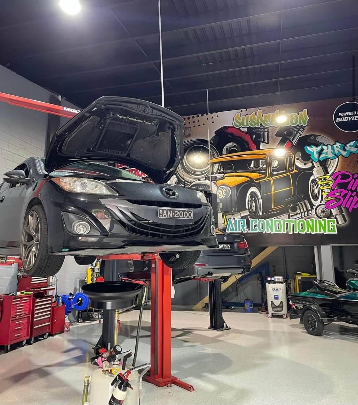 Mazda on hoist in Castle Hill mechanic garage