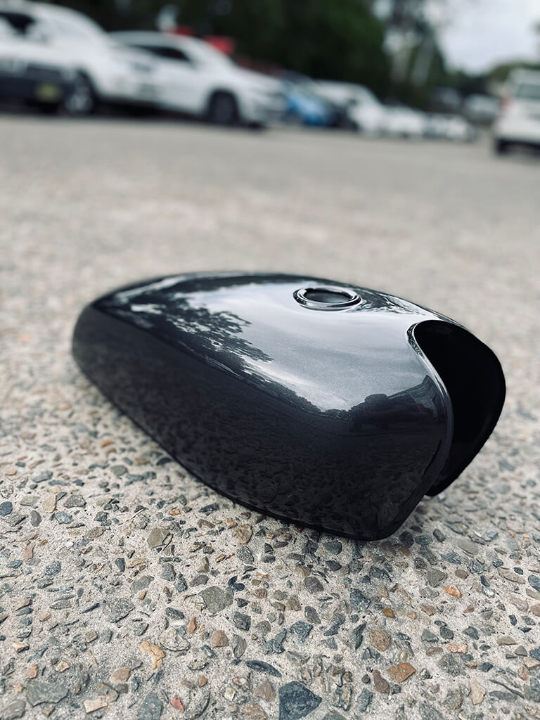Side mirror casing with black powder coating