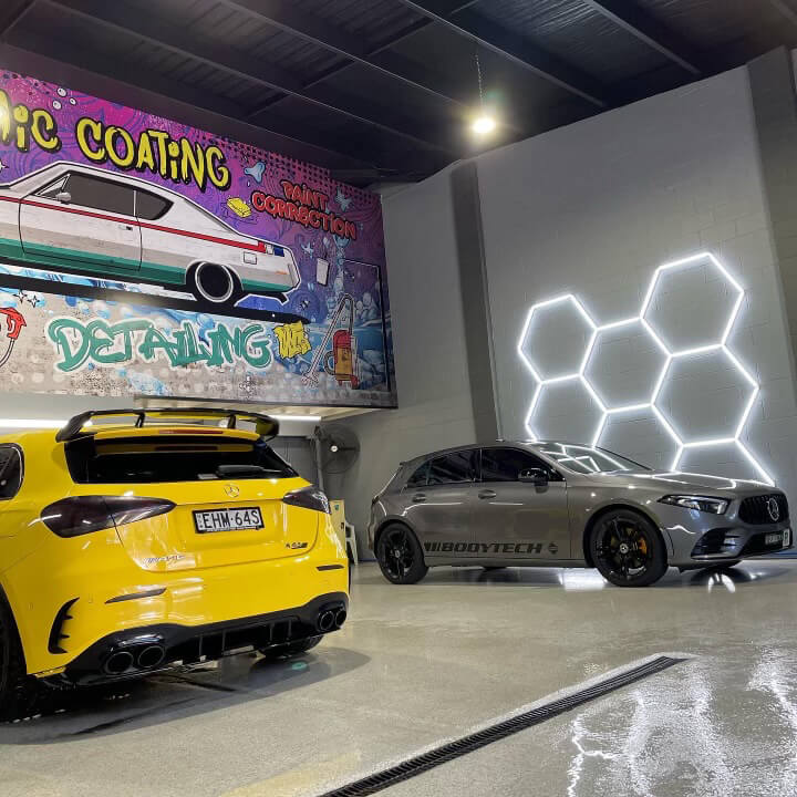Yellow and grey car inside the ceramic coating detailing shop Sydney
