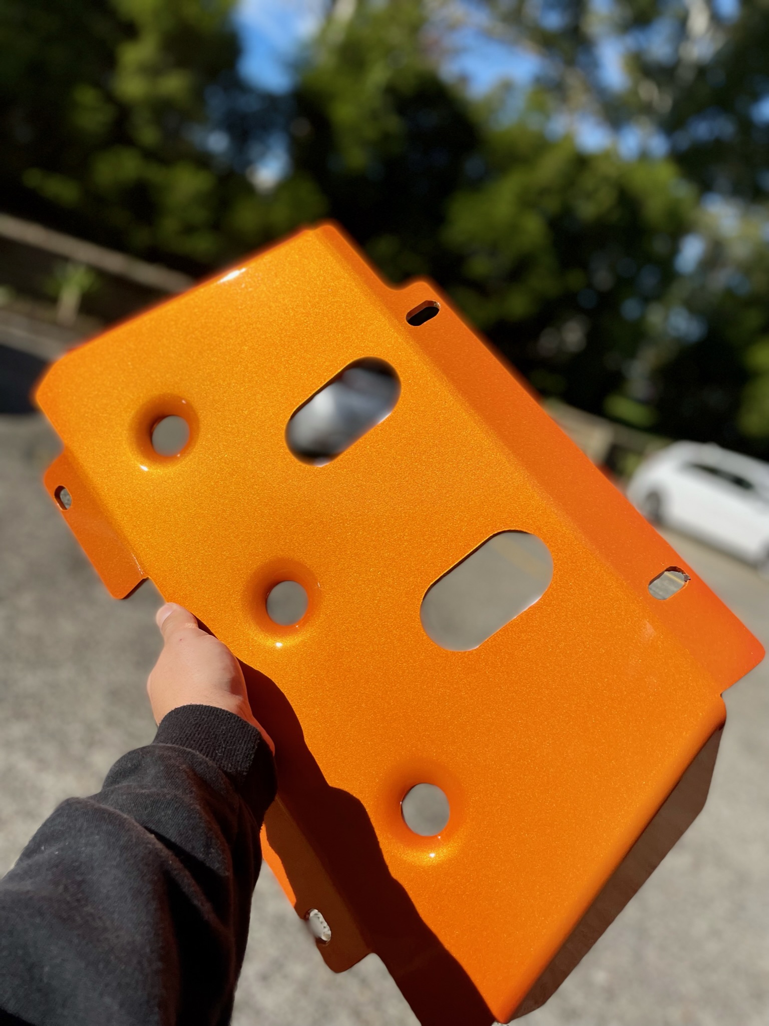 Powder coated orange car part