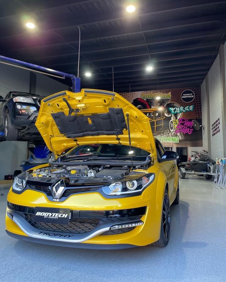 Yellow Renault with open hood