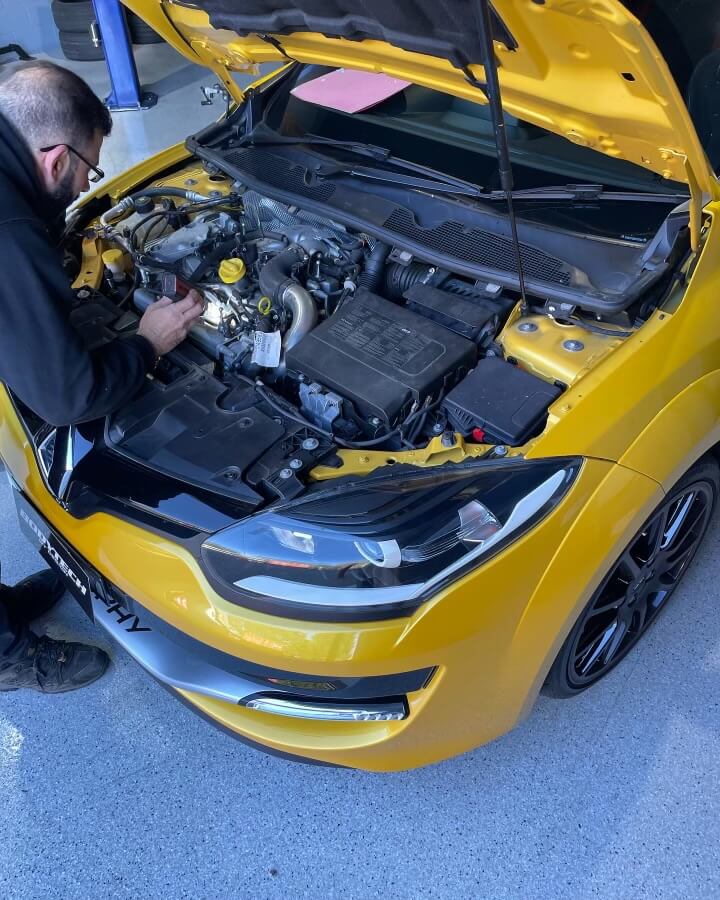 Yellow Renault hood close up