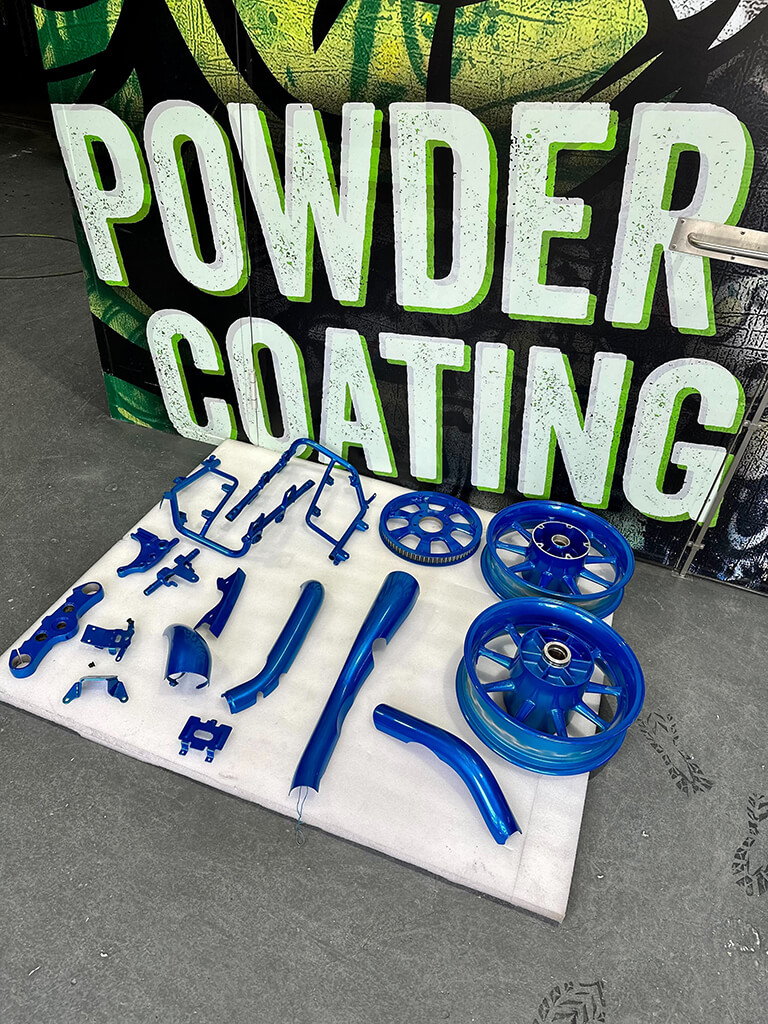 powder coating and spray painting blue parts 3